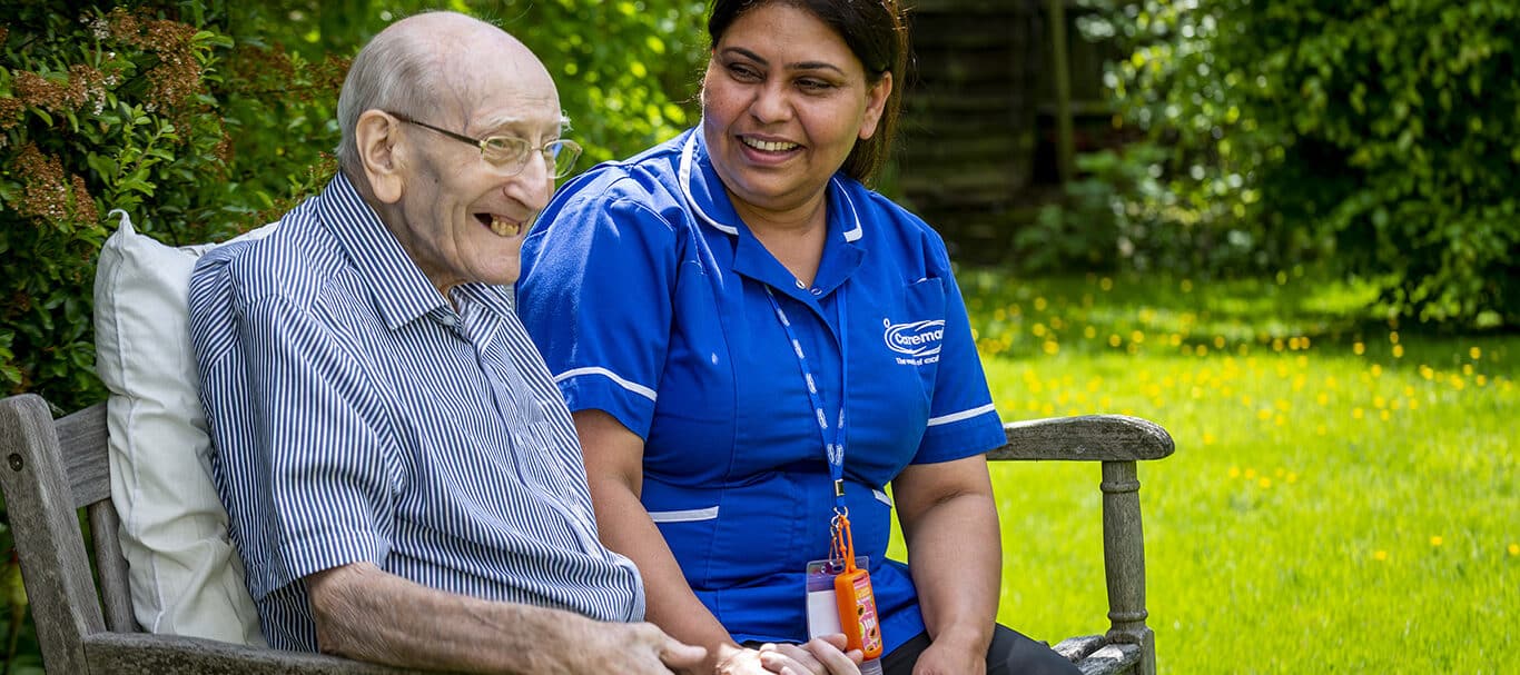 Elderly man and carer