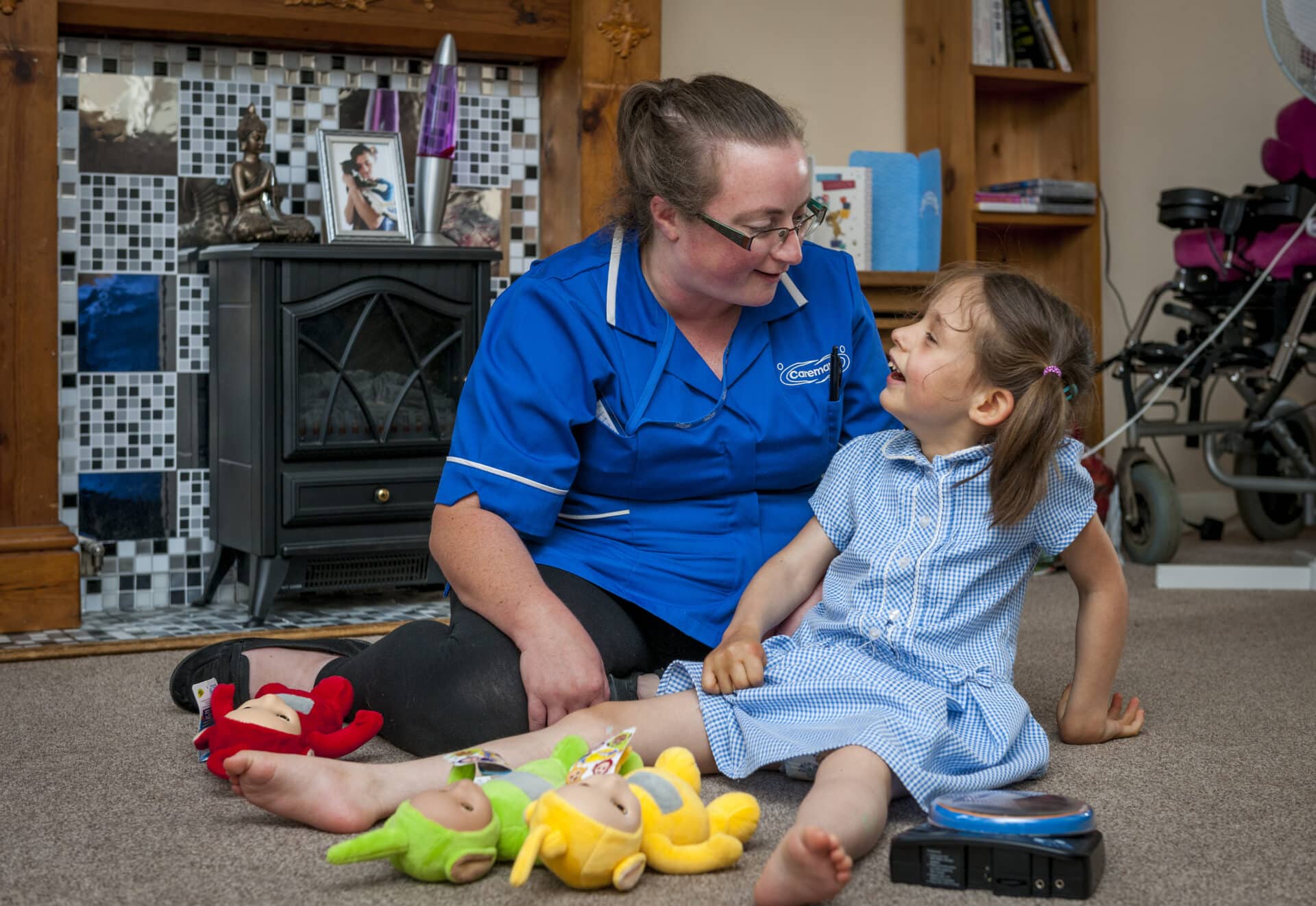 Care assistant playing with a child customer