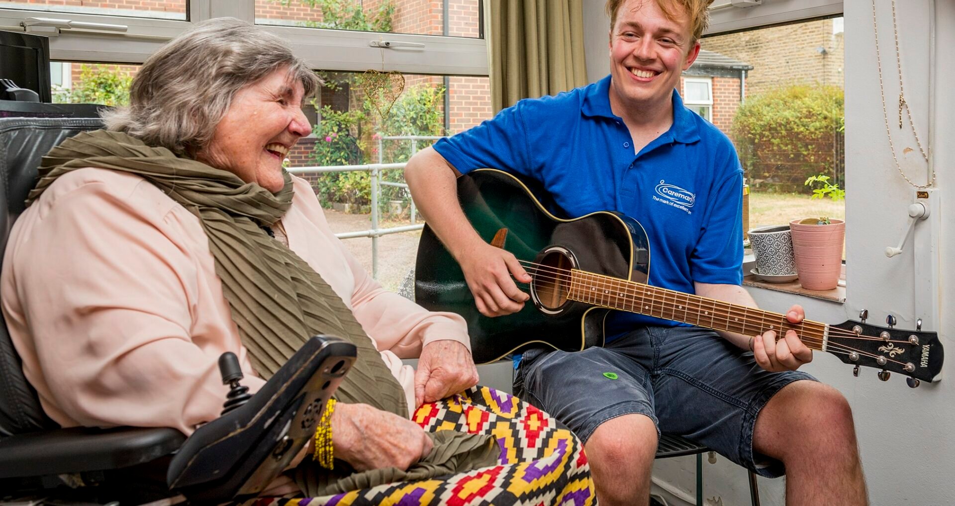 care assistant playing the guitar