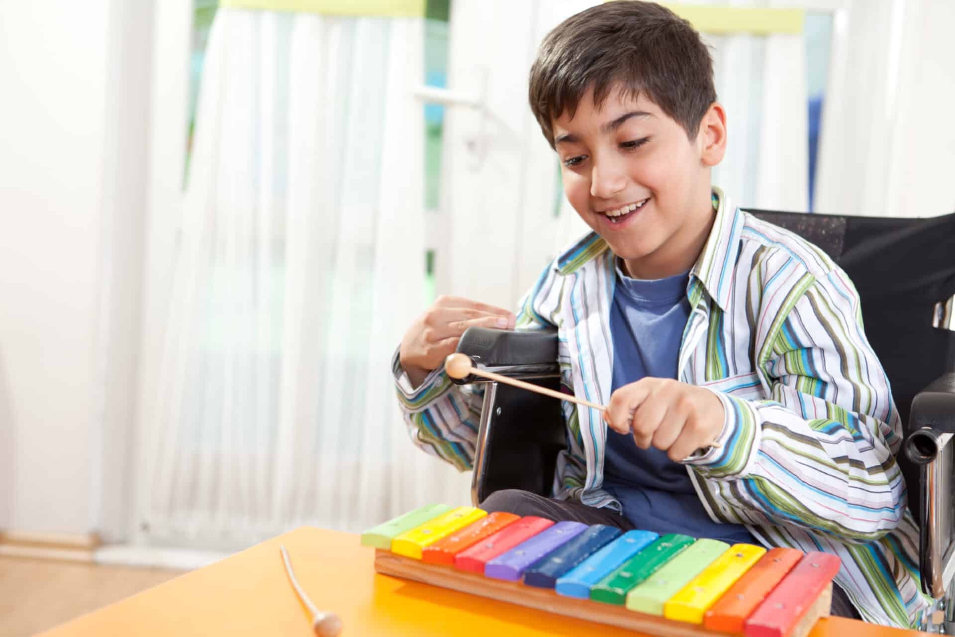 Children Young People Boy playing music 1 scaled