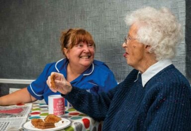 Care assistant and woman eating2 2