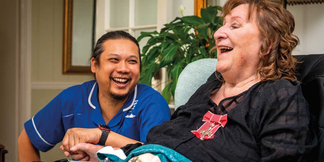 personal care in Wandsworth: care assistant and customer laughing