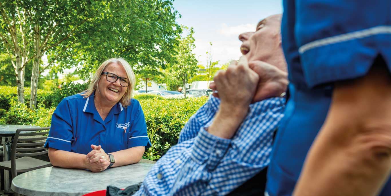 Respite Care in Stratford Upon Avon: female care assistant and male customer out in the community