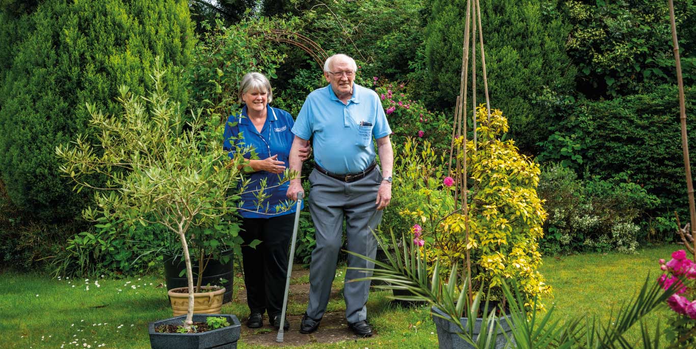 companionship care in Wandsworth: care assistant and man go for a morning walk