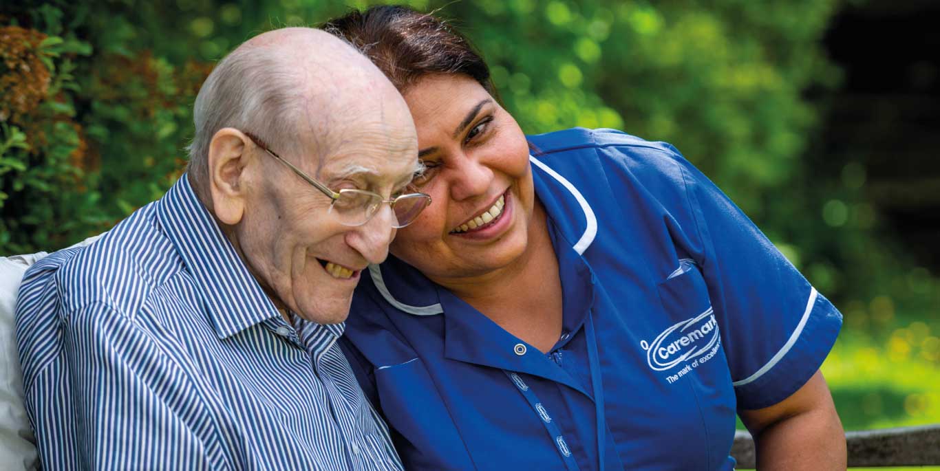 Man with care assistant smiling2