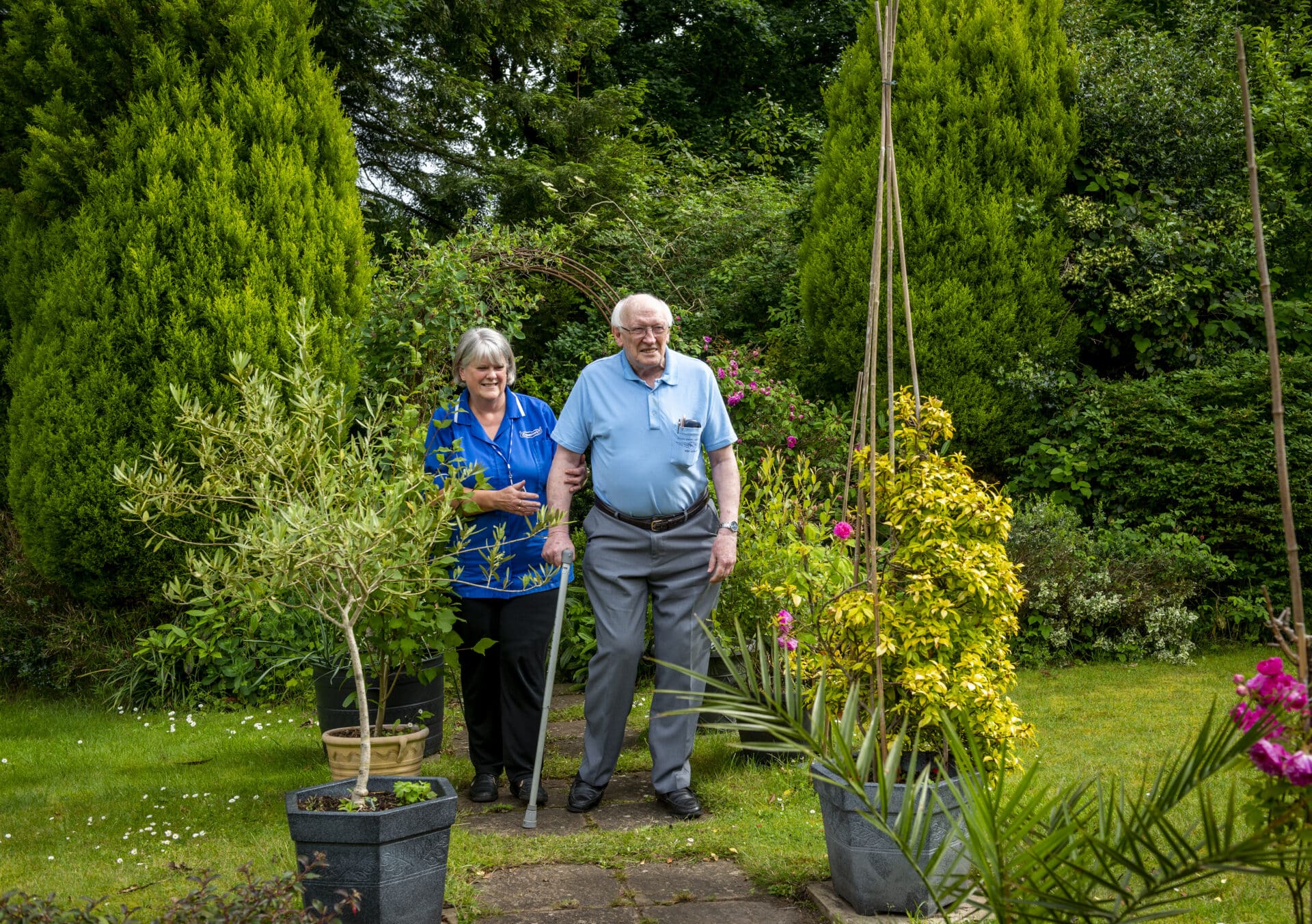 Respite Care in Nuneaton & Bedworth: male customer and female care assistant in garden