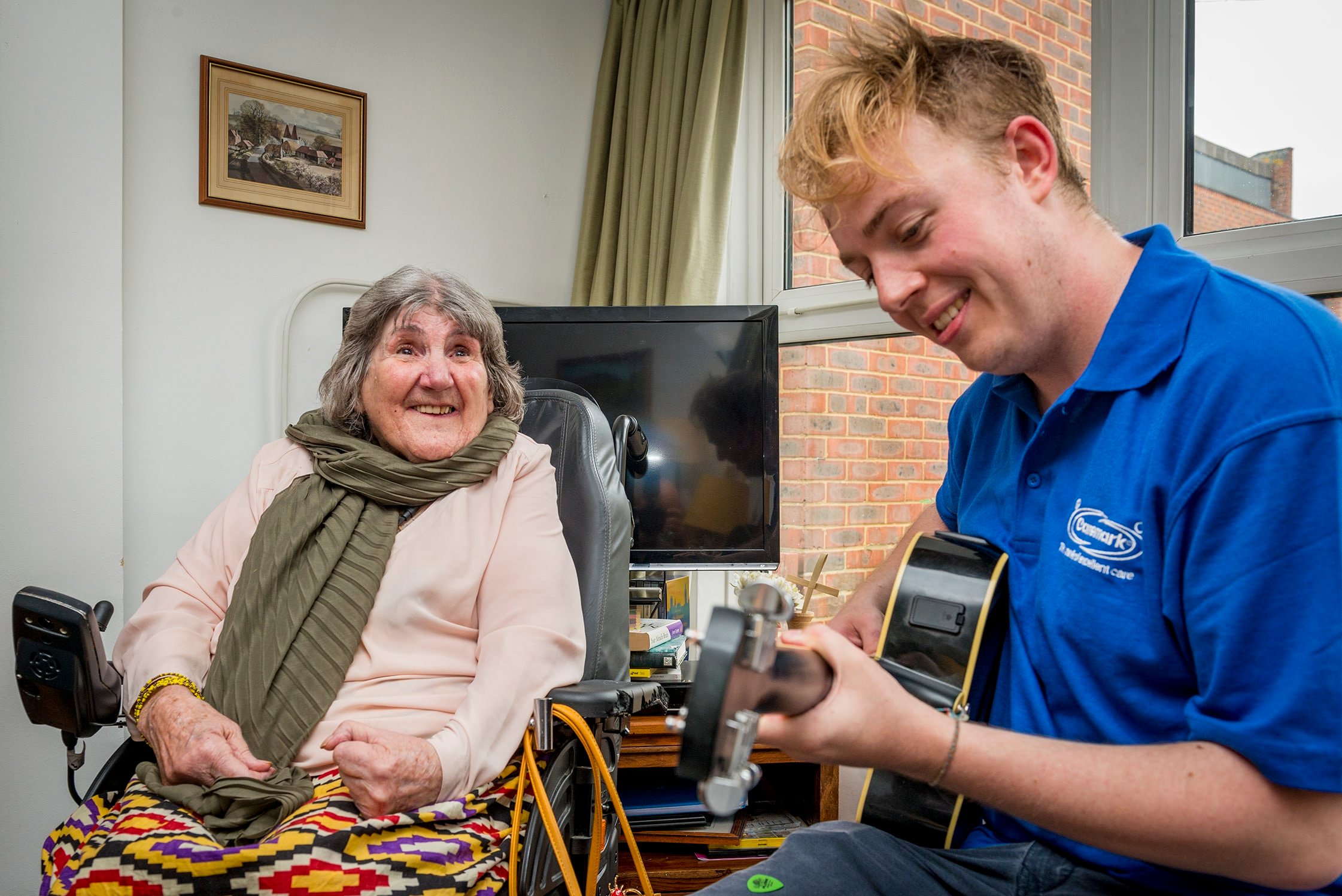 care assistant playing the guitar