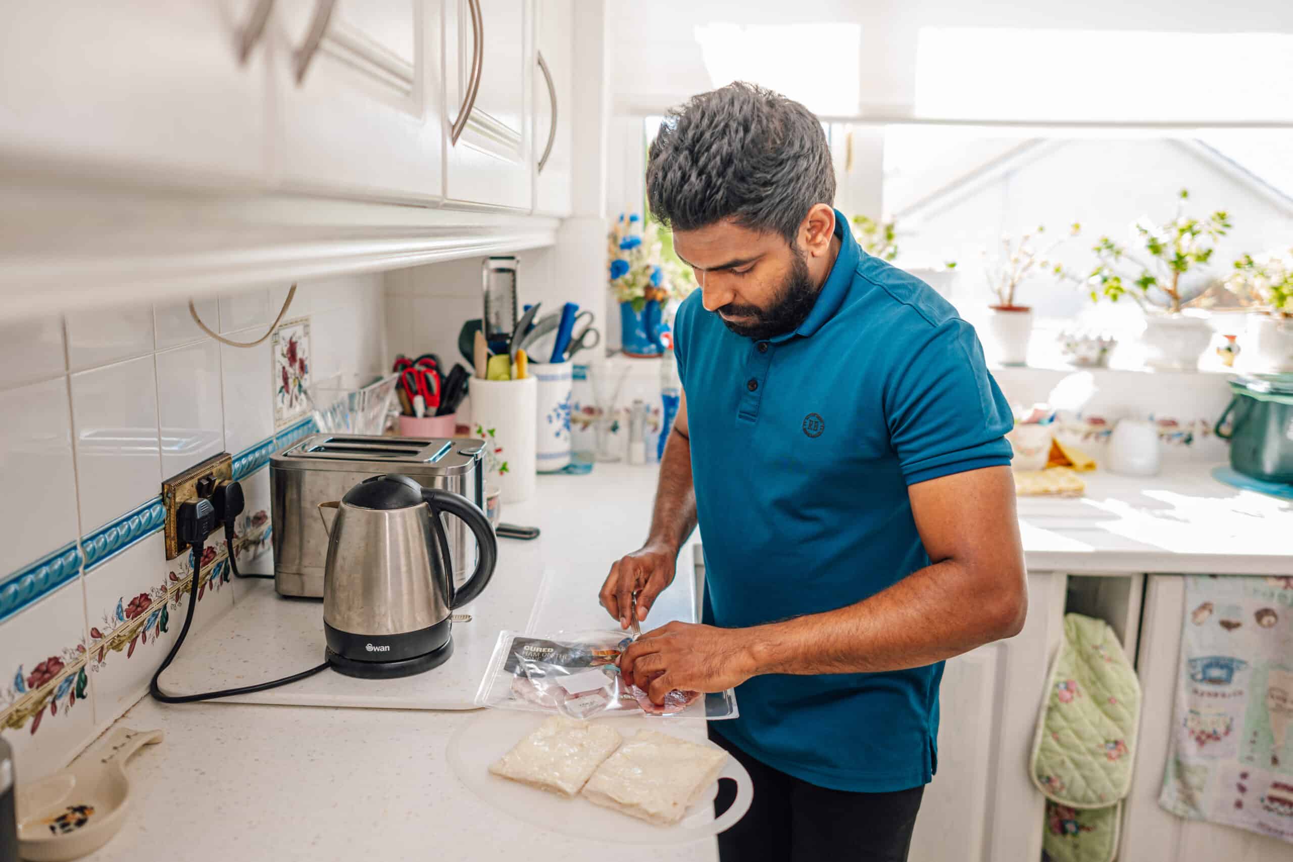 Caremark care assistant helping prepare meals for the elderly