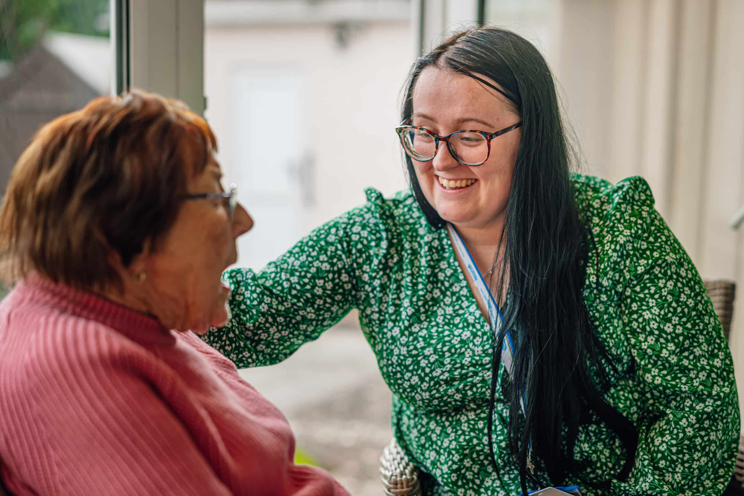 Care Assistant comforting a customer