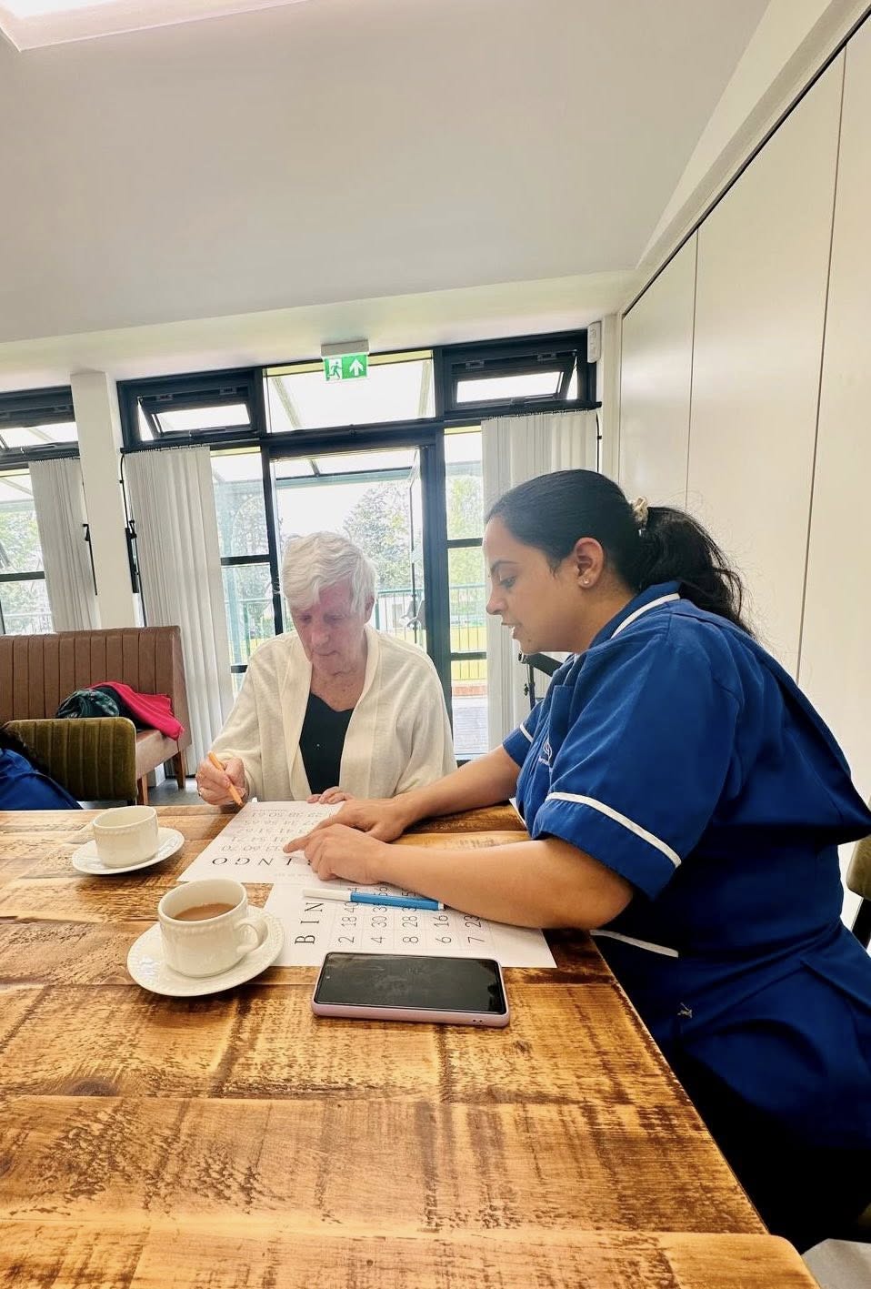 May be an image of 2 people, people studying and table