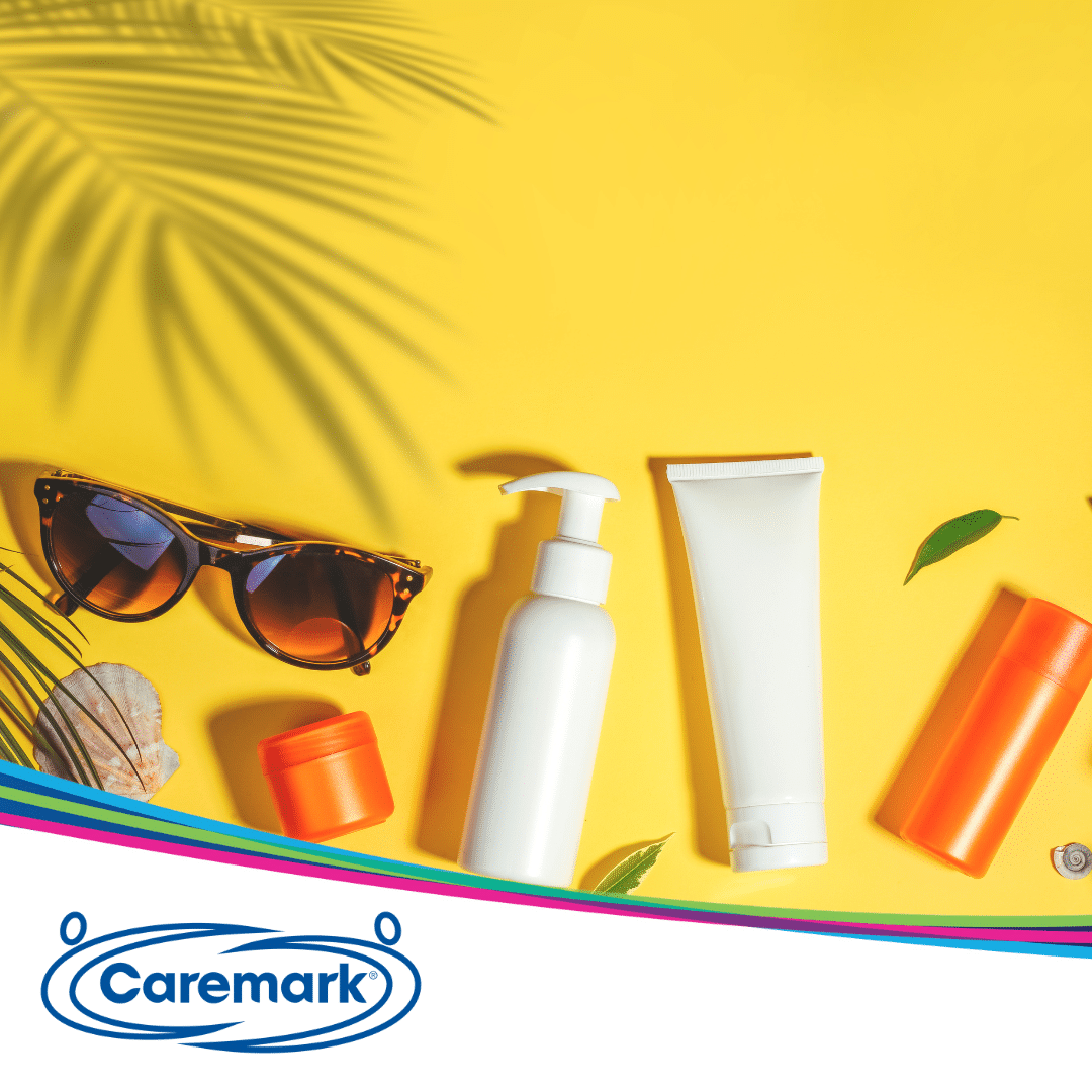 Summer essentials, including sunglasses, sunscreen laid out for staying safe in the hot weather