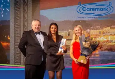 Sharon Dhillion receiving an award from Caremark CEOs..