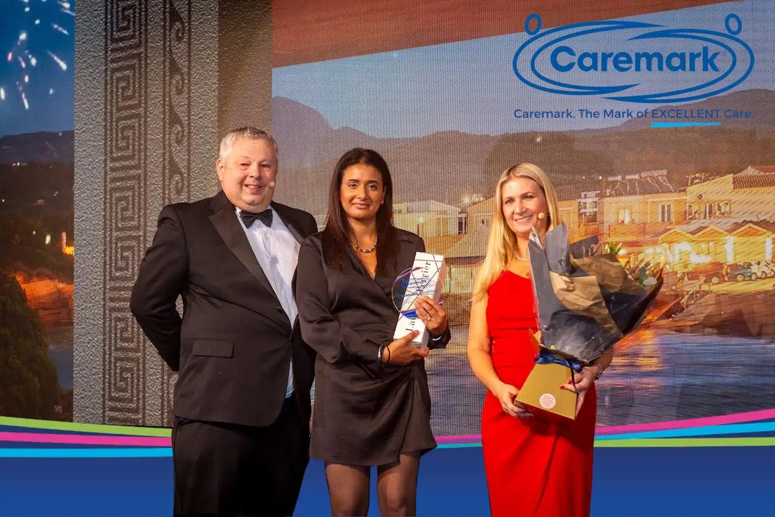 Sharon Dhillion receiving an award from Caremark CEOs..