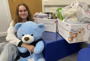 our social media coordinator, Leja, holding Blue, fundraising for cat shelter