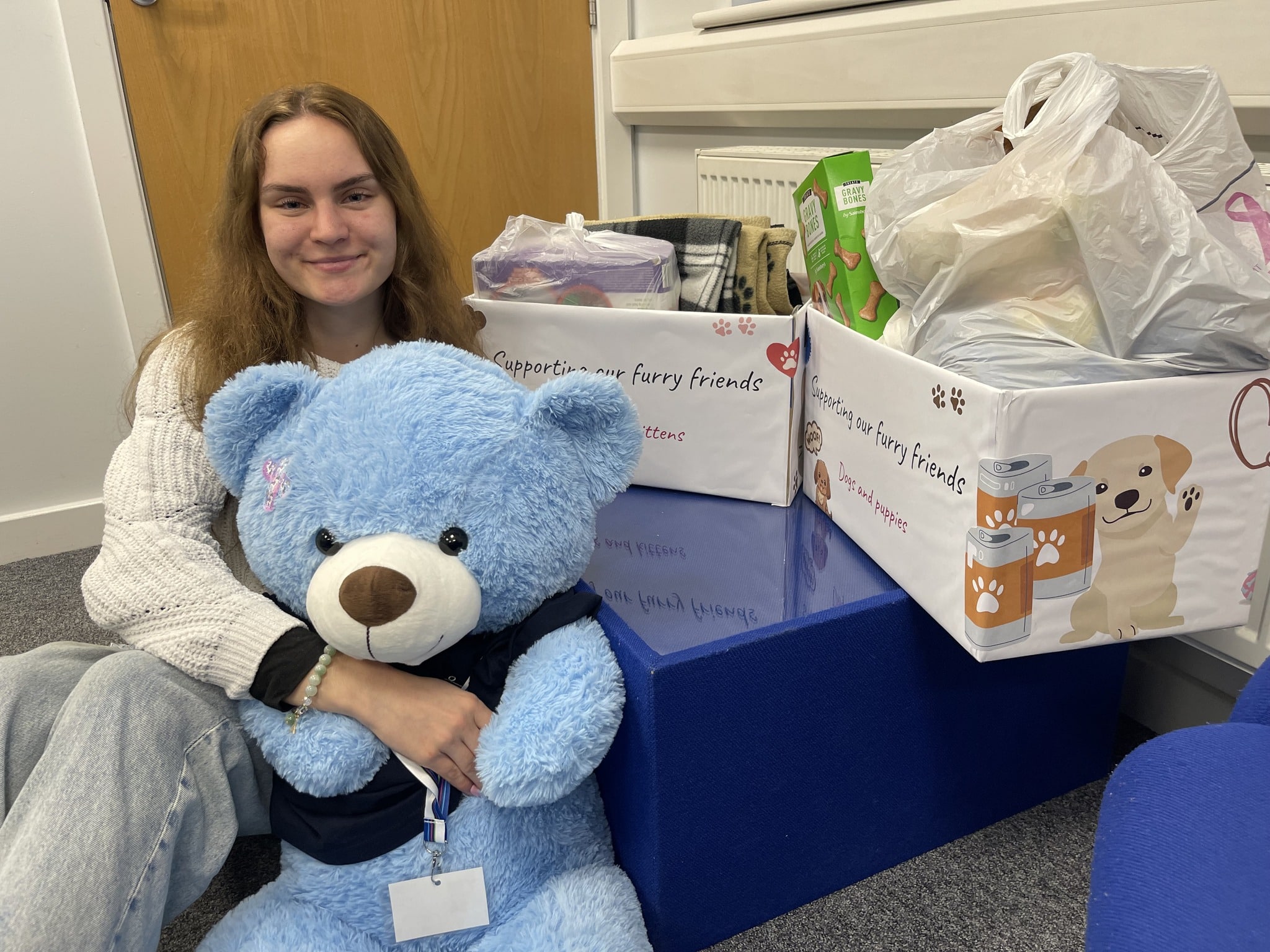 Leja, our social media coordinator fundraising last year with two boxes full of donation for animals for Cat-ttitude n whiskers