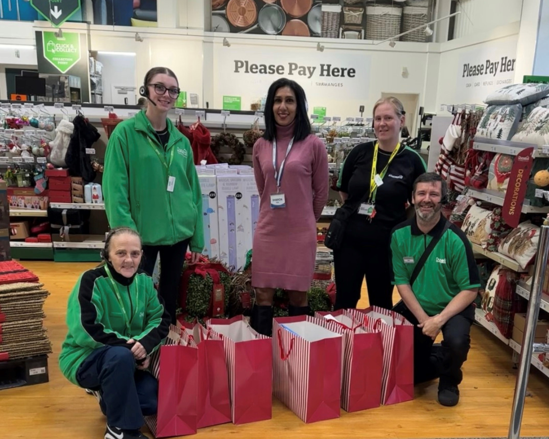 Caremark North Herts and Stevenage Marketing Manager Sharon Stevens delivering christmas gifts to staff at Dunelm Stevenage for the Delivering Joy 2025