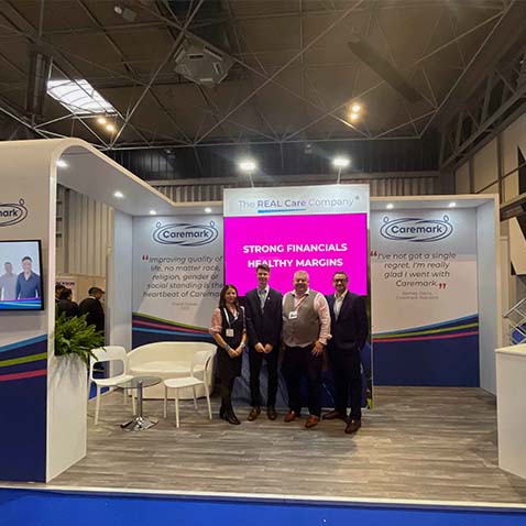 Caremark stand at the NEC franchise exhibition, showcasing the REAL Care Company home care franchise opportunity with Caremark team on the stand.