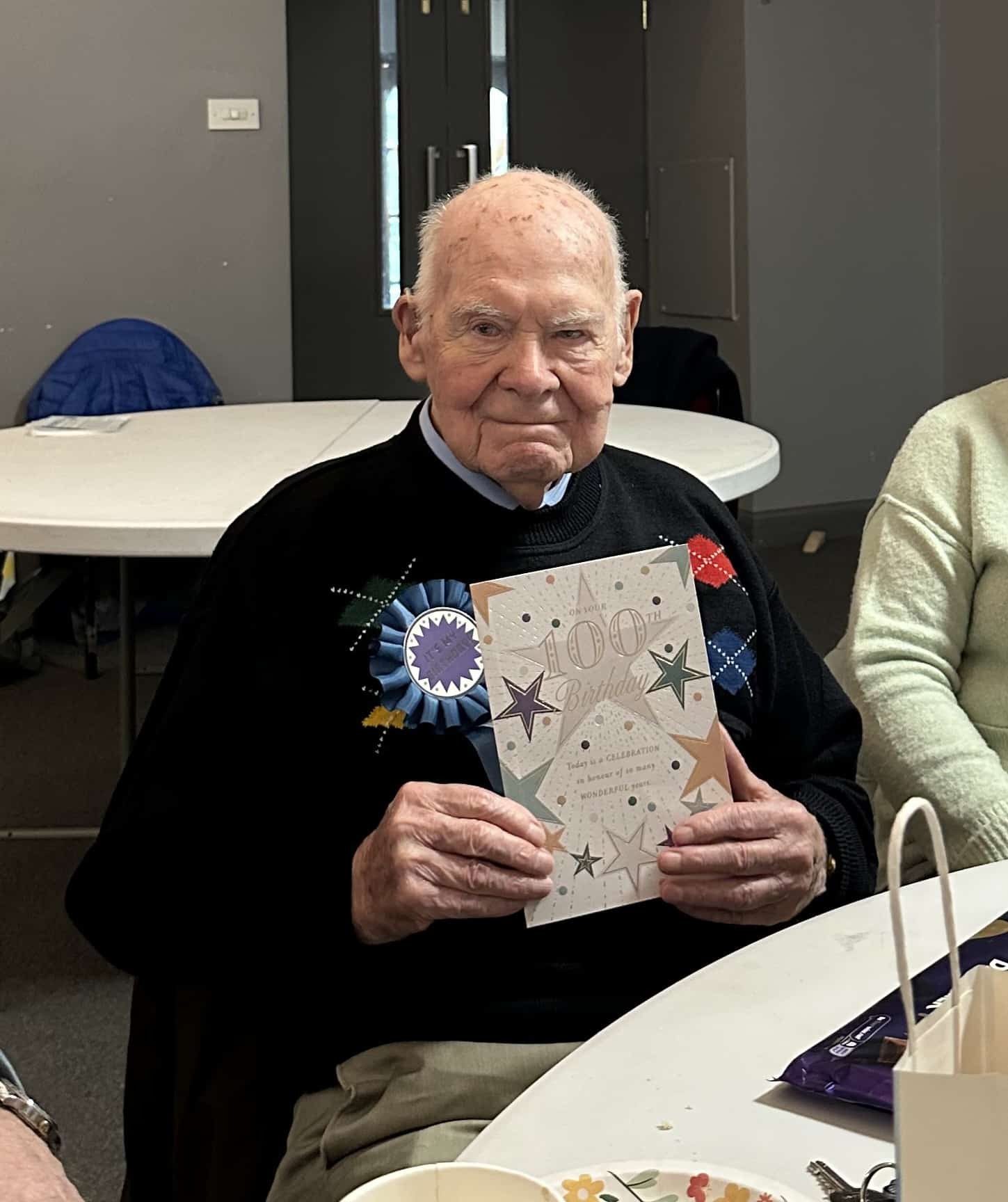 George celebrating his 100th birthday at the Memory Cafe