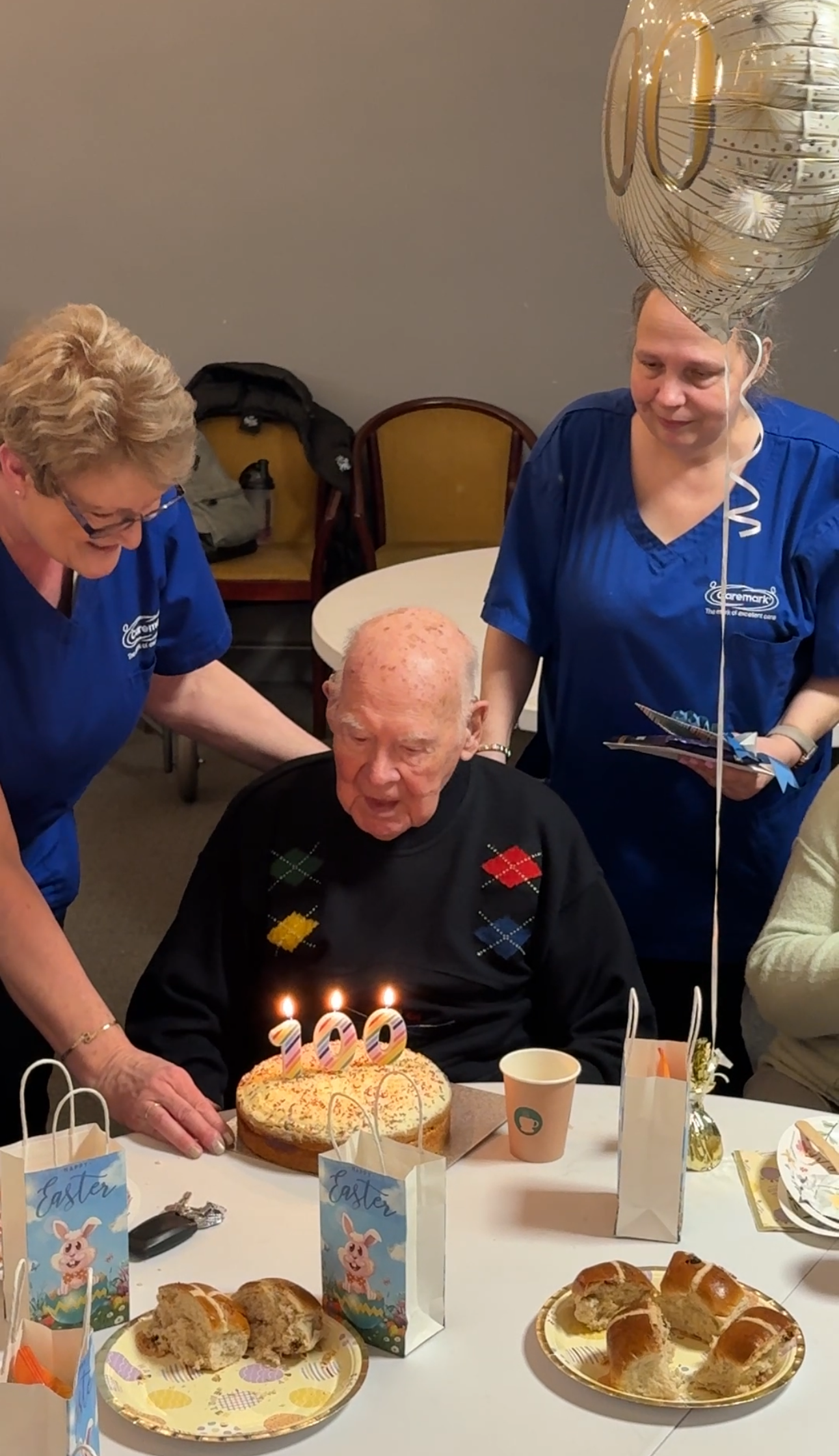 George celebrating his 100th birthday at the Memory Cafe with his birthday cake