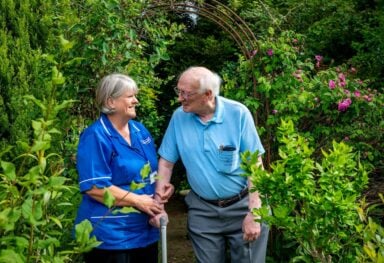 The carer as witness: Caremark carer with customer in garden