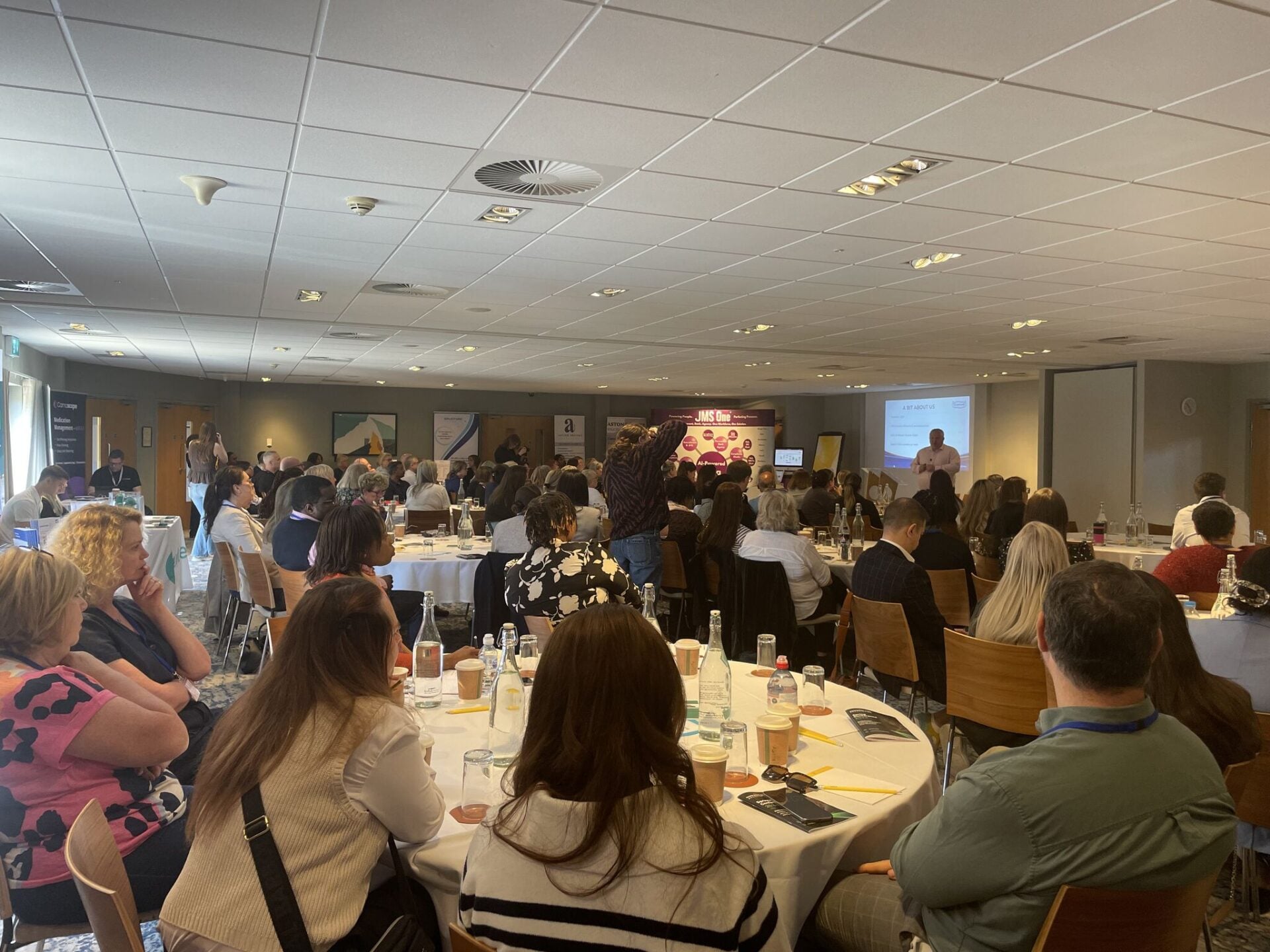 Caremark CEO David Glover speaking at a home care conference about franchisor support, resilience and care leadership.