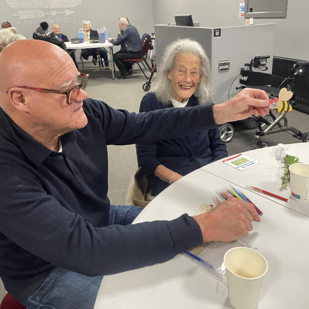 service users showing off craft they made
