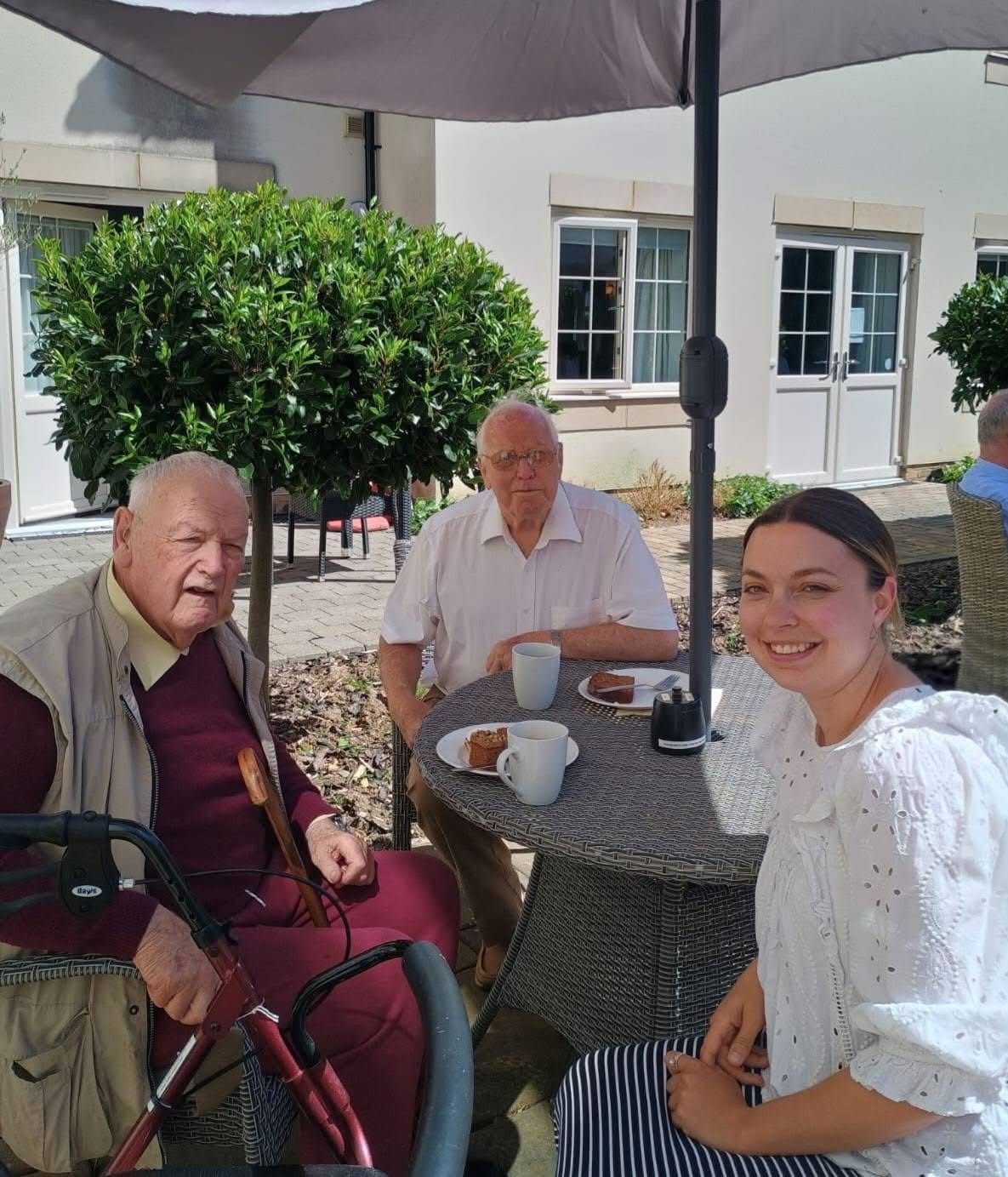Lauren, our Deputy Manager at Caremark Arun sitting in the sunshine at Walberton Place Care Home chatting to one of our clients all about his passion for the drums!