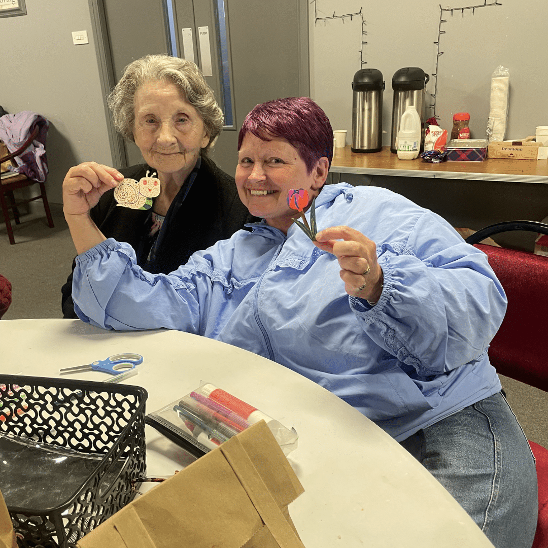 service users smiling with crafts they made