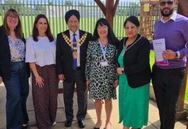 Caremark Solihull Managing Director receives 5 year loyal service volunteering for Age UK Solihull