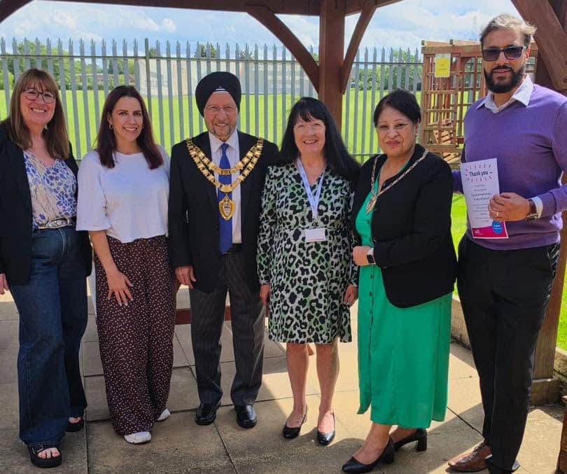 Caremark Solihull Managing Director receives 5 year loyal service volunteering for Age UK Solihull