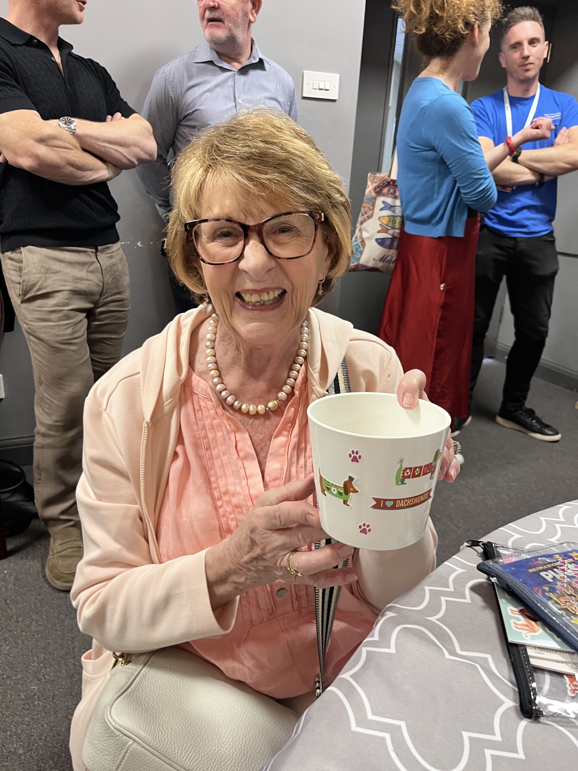 service user holding up her plant pot
