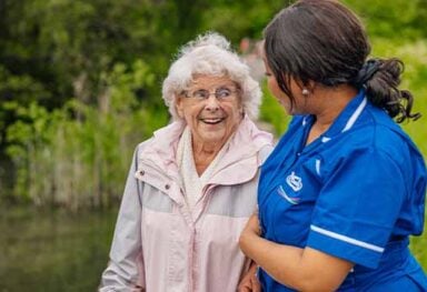 Care Assistant spending time with an older person at home