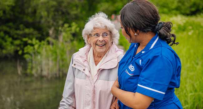 Care Assistant spending time with an older person at home