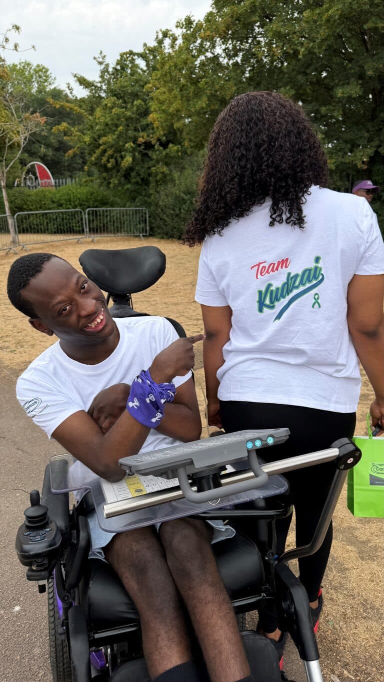 Kudzai with his Team Kudzai t-shirt at Wheelathon 2026. Kudzai lives with Cerebral Palsy and enjoys adapted cycling.