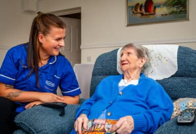A photo of a Caremark care assistant and customer celebrating 10 years of caremark bristol