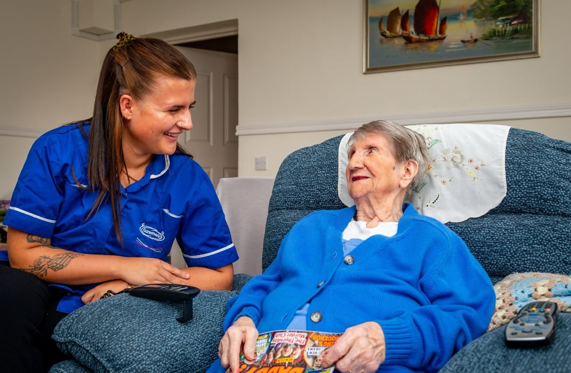 A photo of a Caremark care assistant and customer celebrating 10 years of caremark bristol