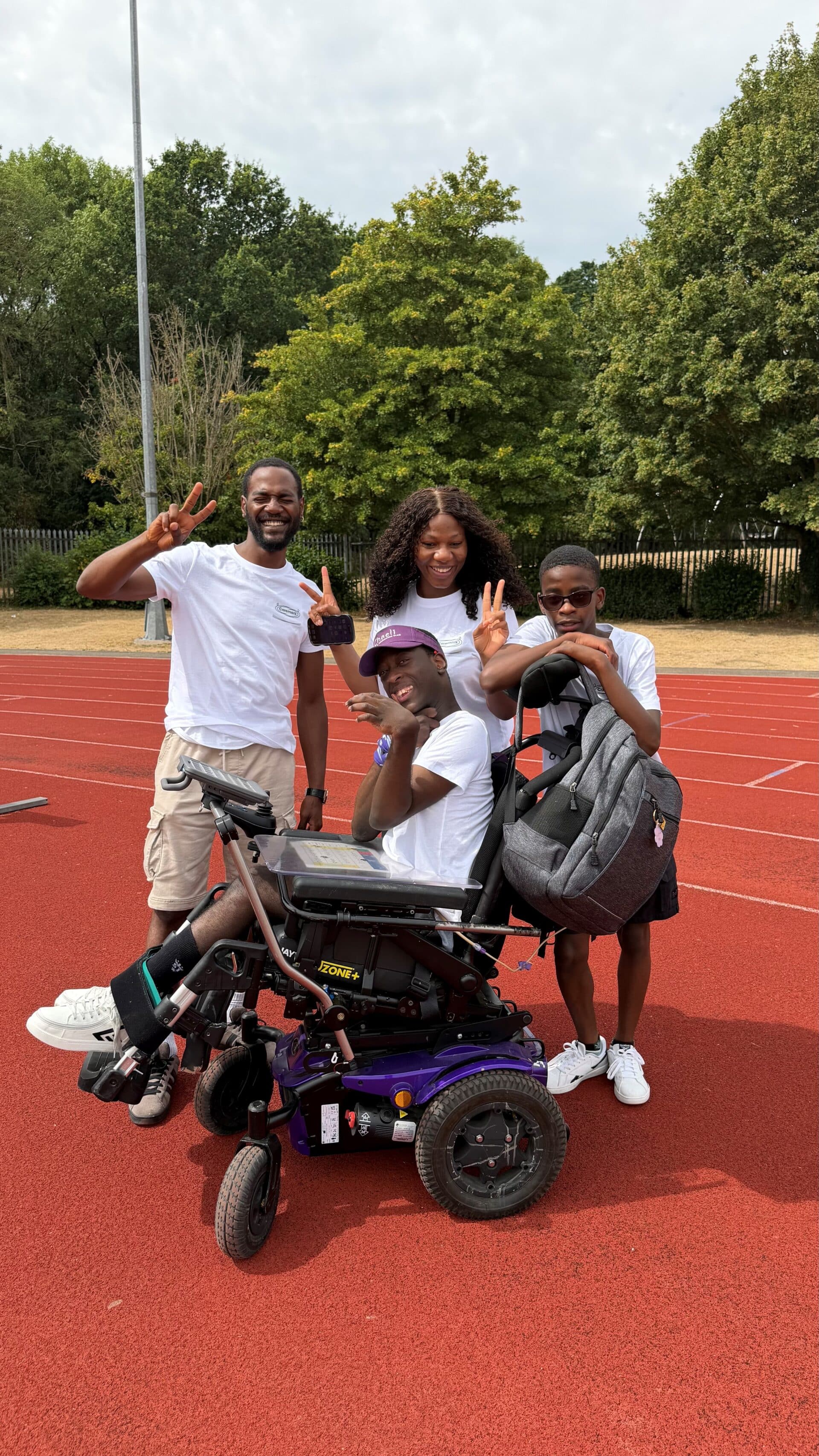 Kudzai with North Herts and Stevenage Care Assistants, Kola, Esther and his younger brother.