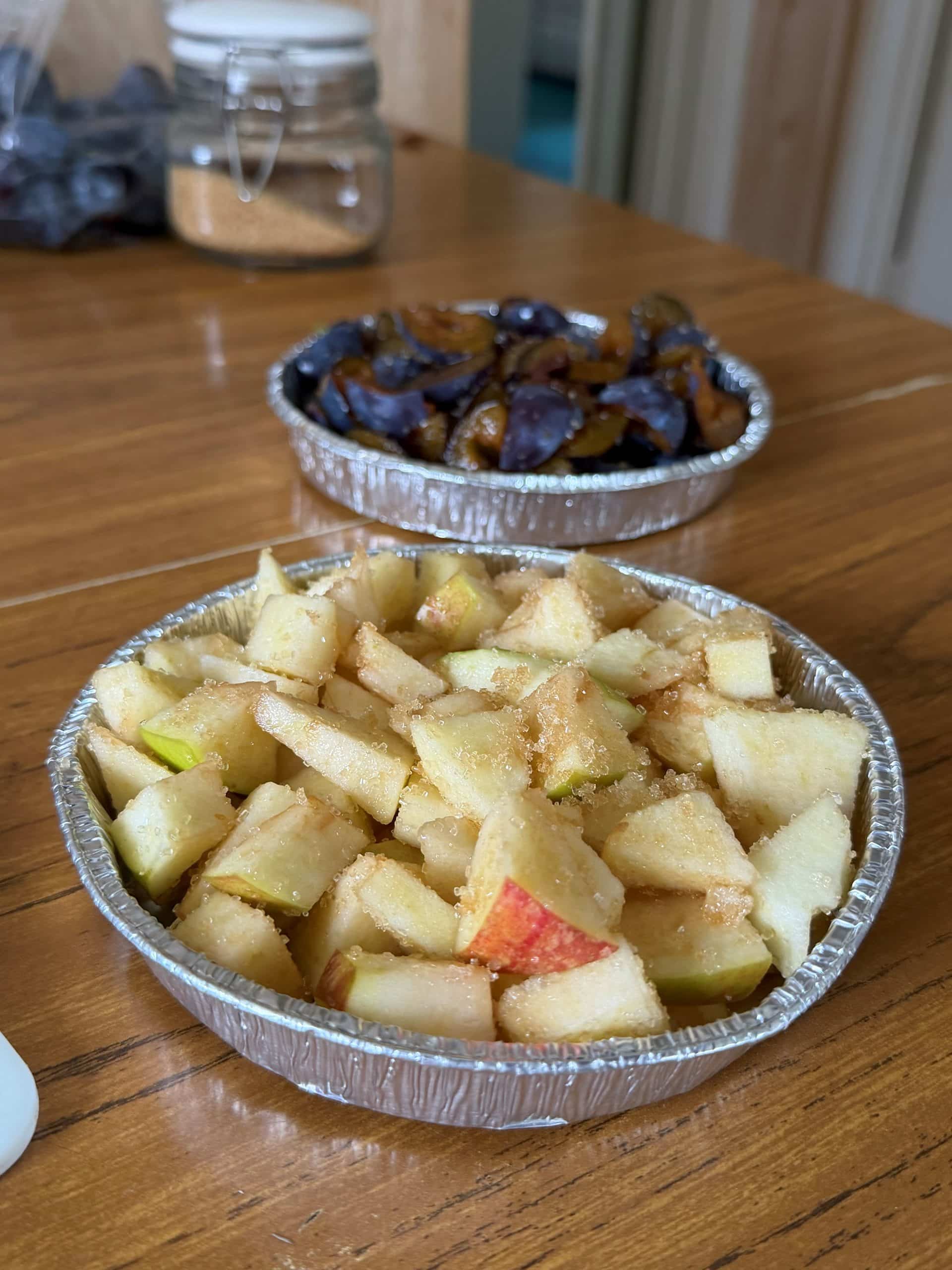 Caremark North Herts and Stevenage apple crumble cooking lessons for homecare staff. apples are cut and brown sugar added.